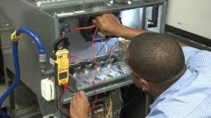 lead refrigerator technician inspecting scotsman ice machine